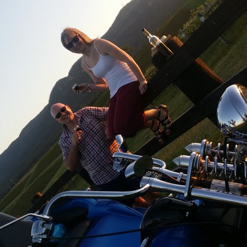 couple having picnic on winery fram