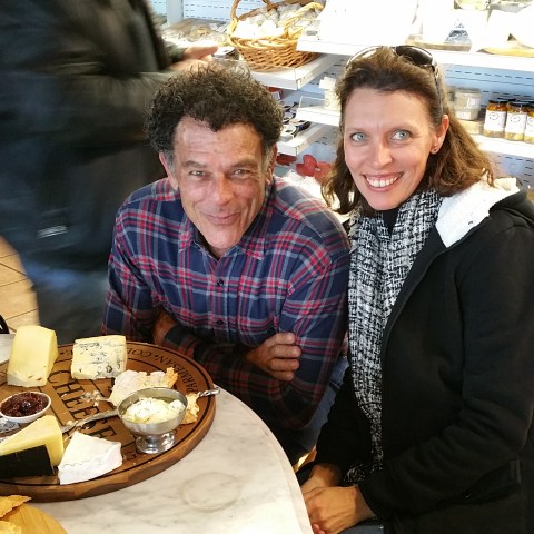 couple tasting cheese and cake