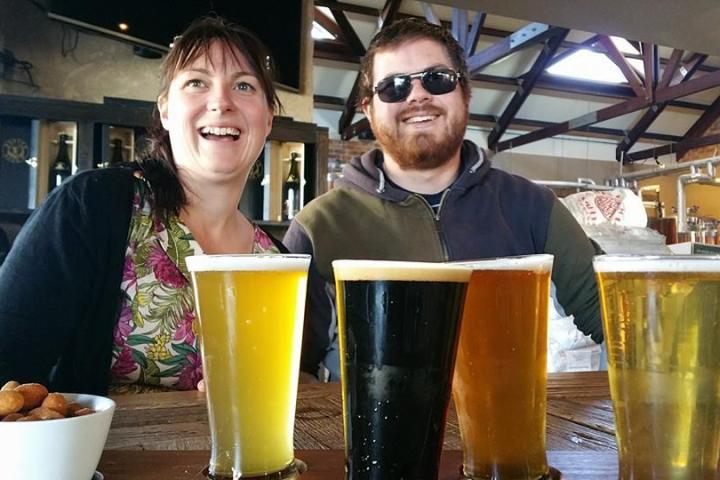 Couple tasting beer and cheese