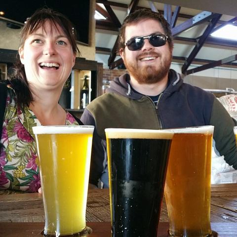 couple tasting beer and cheese