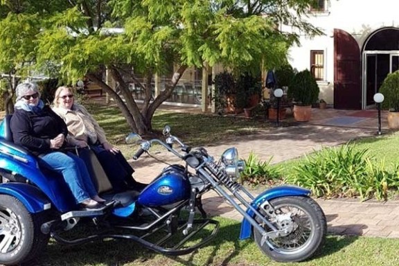 a motorcycle parked on the side of a building