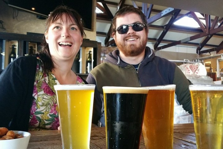 a person sitting at a table with a cup of coffee