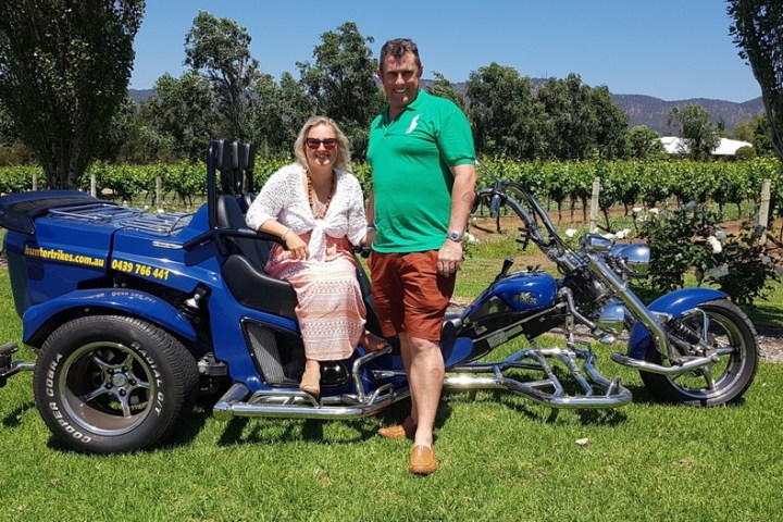 a man sitting on a motorcycle