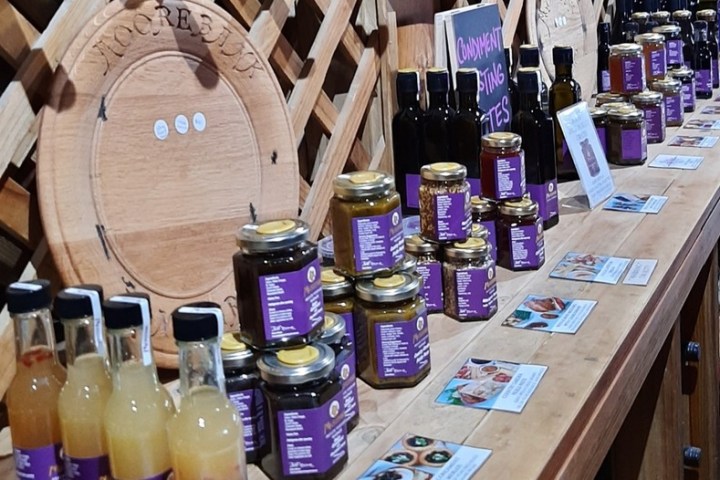 a bottle of wine sitting on top of a wooden table